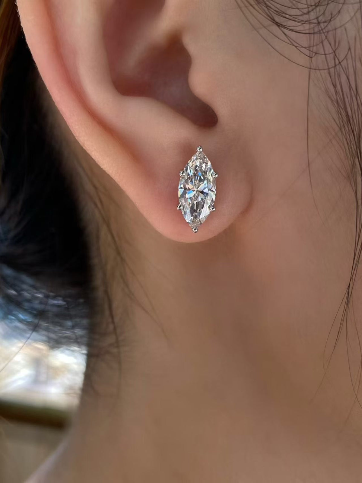 Marquise solitaire lab diamond stud earrings worn on ear