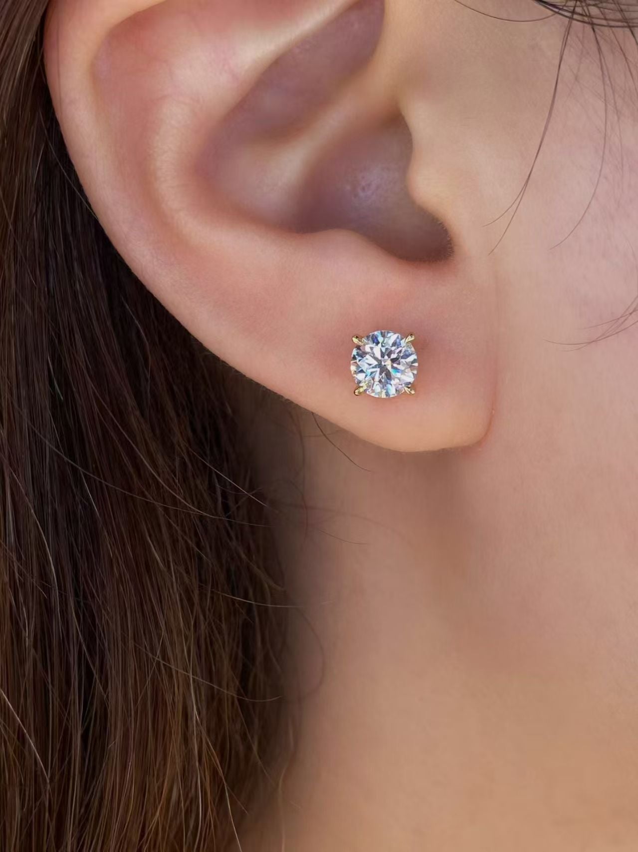 Round brilliant lab diamond stud earring worn on ear - lifestyle shot